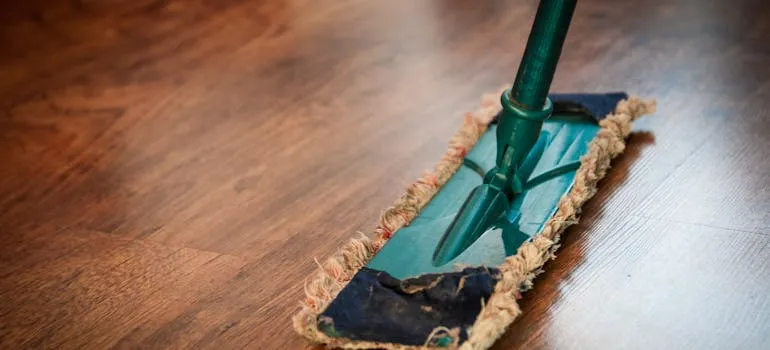 A person cleaning a floor