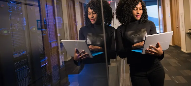 A woman holding a laptop
