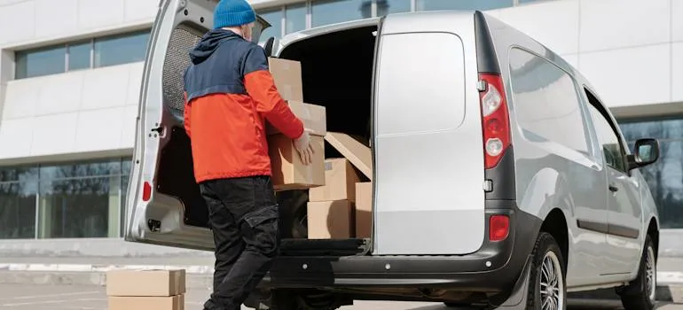 A person loading a moving van