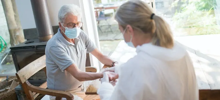 A doctor doing medical examination of an elderly person