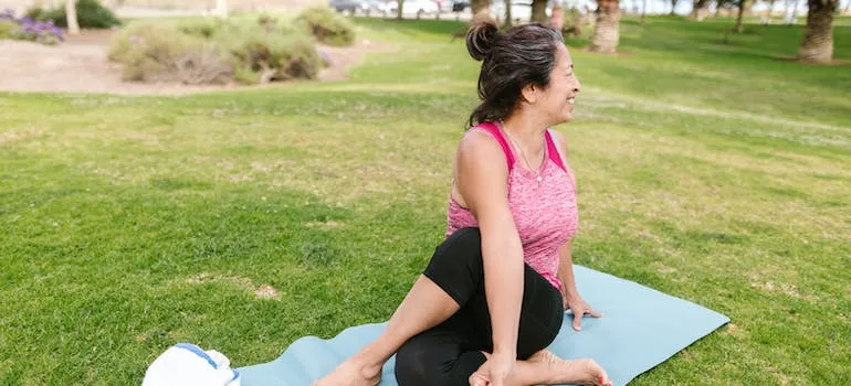 An elderly woman doing yoga 