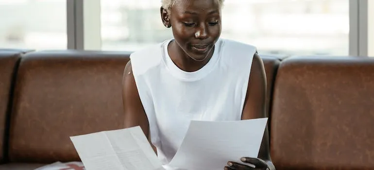 A woman comparing documents