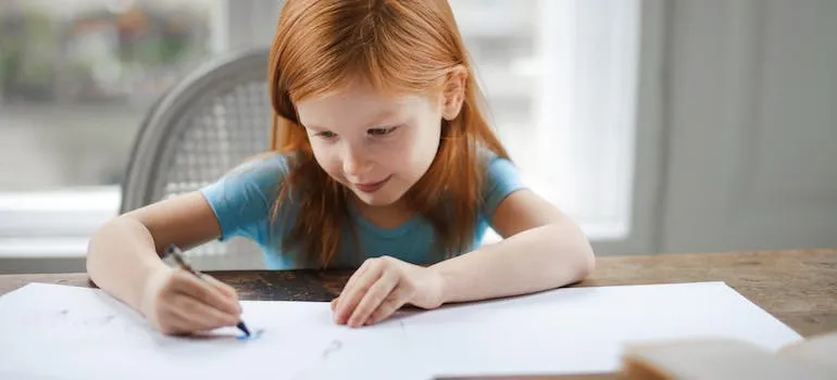 A kid drawing on paper
