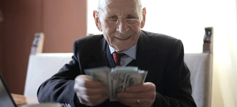 A senior counting dollar bills