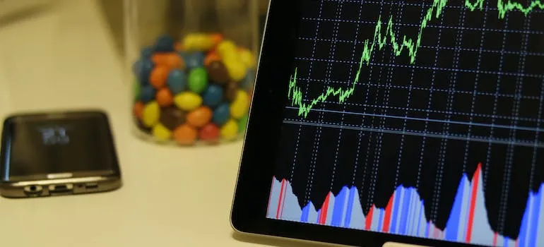 A graph on the tablet representing growth of the real estate market in Bethesda