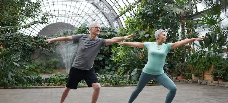 Two people doing yoga in one of the best places to retire in Maryland