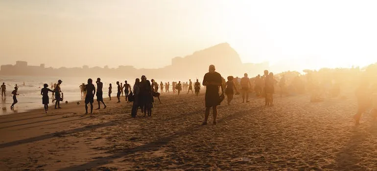 People on the beach during sunset 