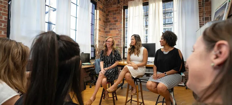 Three women engaging with the community