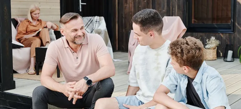 A father talking and helping kids adjust to a new school in Washington