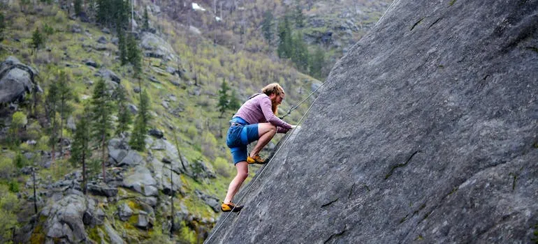 A man climbing on the rock mountain