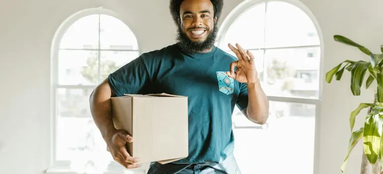 A mover holding a moving box