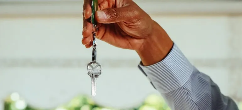 A person holding a key 