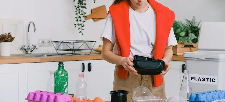 A woman recycling 