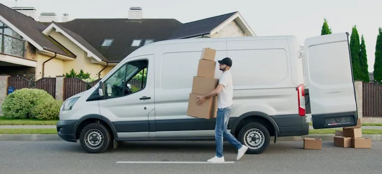 A mover unloading a moving van