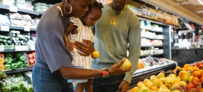 A family buying groceries