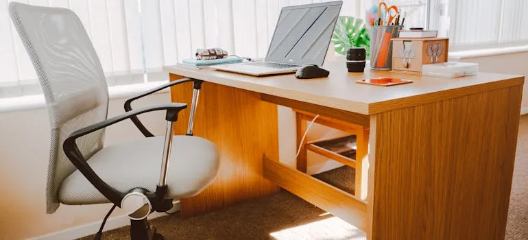 A chair and desk in the office space 