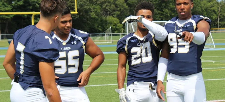 Four football players