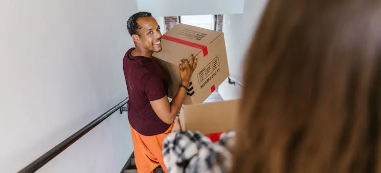 A mover helping a woman with an interstate relocation from Virginia