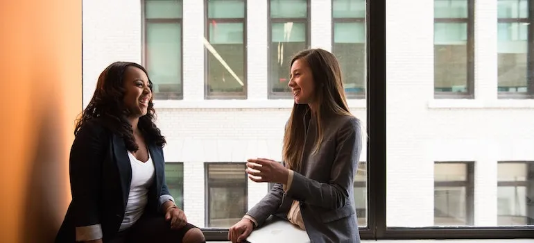 two coworkers laughing on a break