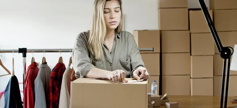 A woman packing a box 