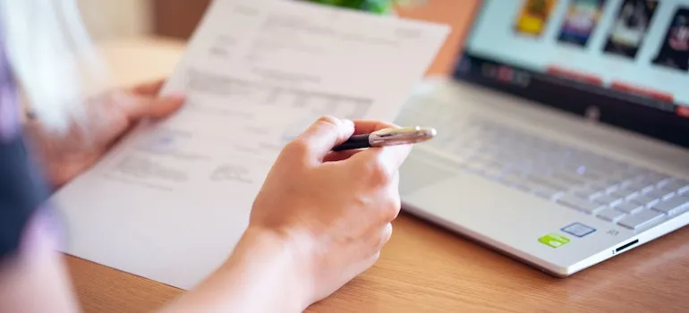 a person taking care of paperwork