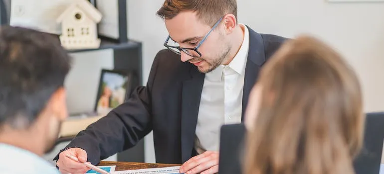 a couple talking with a job recruiter
