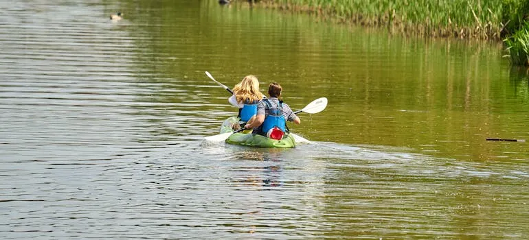Couple kayaking in one of the places in Maryland for couples