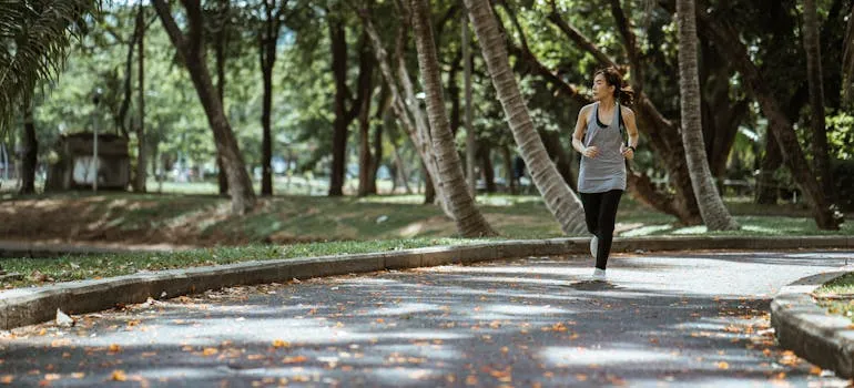 A woman jogging in the park in one of the best cities to live in Maryland