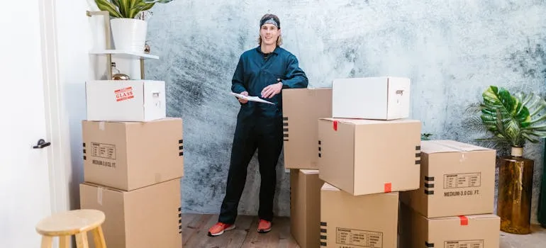 A mover standing between boxes