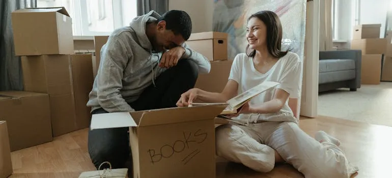 A couple packing books