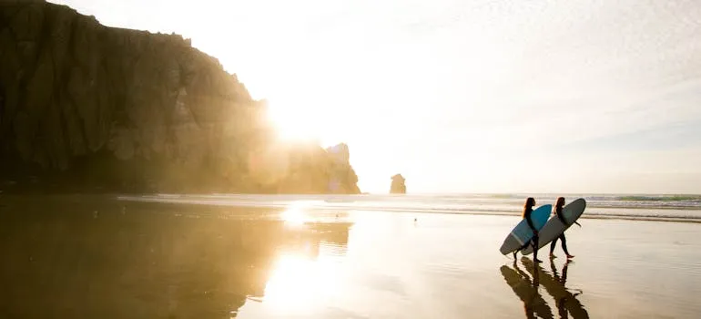 Two surfers on the beach