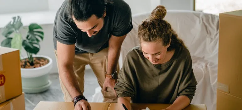 A couple making a checklist for moving from DC to Austin