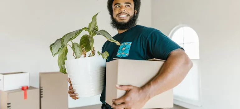 A mover holding a moving box
