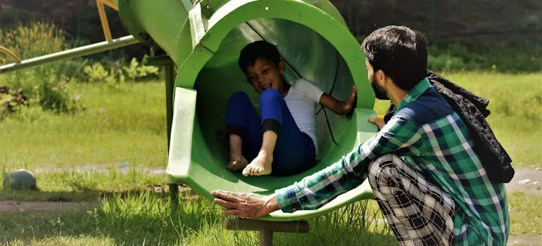 A kid and a father in the park