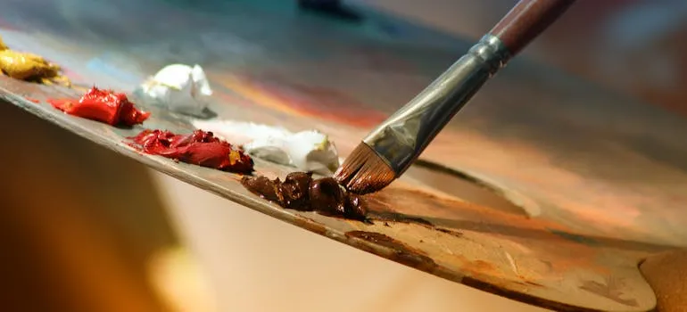 An artist holding a paintbrush