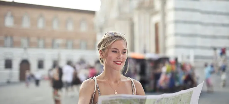 A woman holding a map