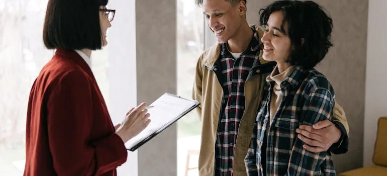 A couple talking with the real estate agent