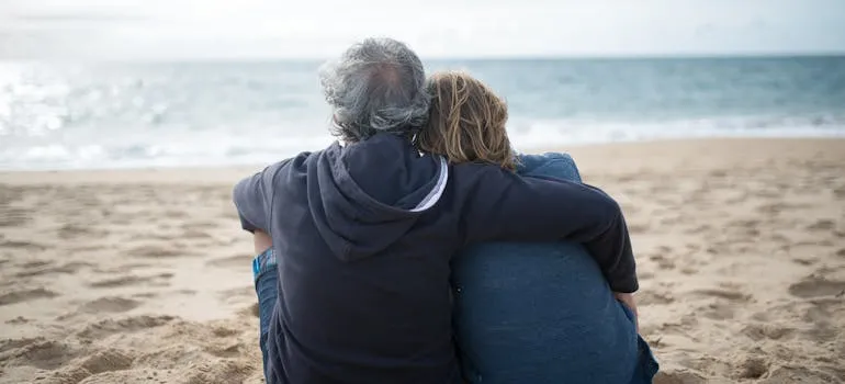 A couple on the beach in one of the states Maryland residents are moving to