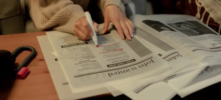 A woman searching for job postings