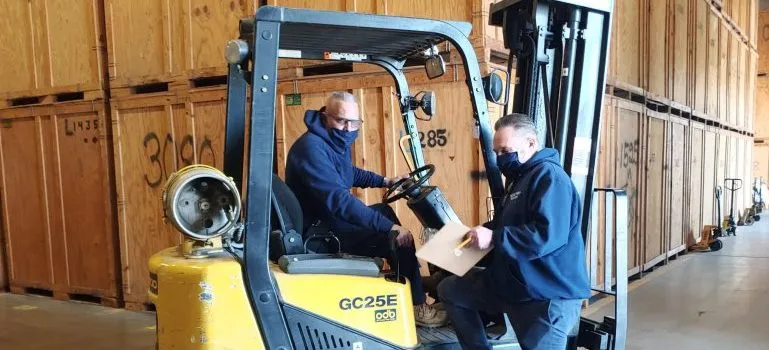 two Beltway workers in a warehouse