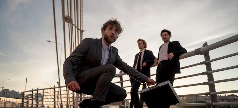 Three men in the suits in one of the remote work-friendly cities in Virginia
