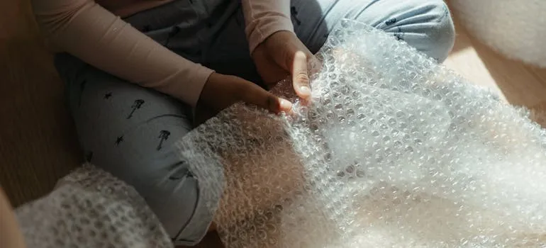 A person holding a bubble wrap