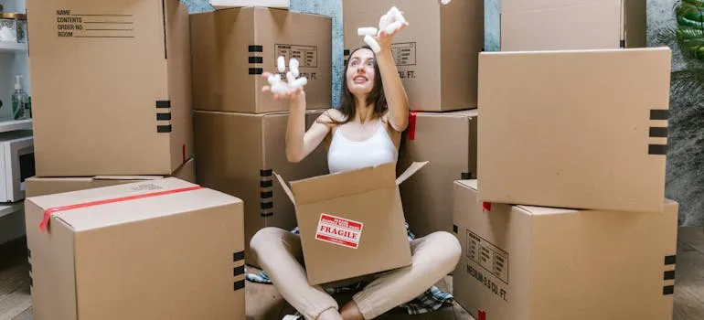 A woman packing for moving from Laurel to Bethesda