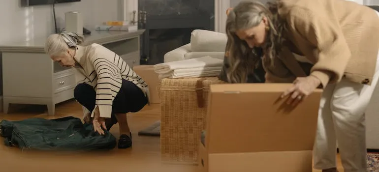 Two women packing