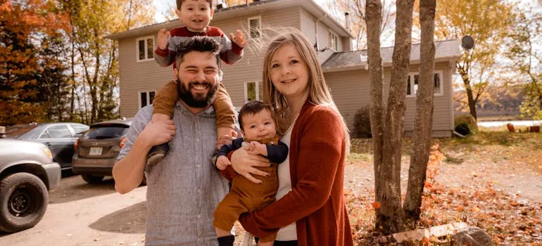 A family in front of the house