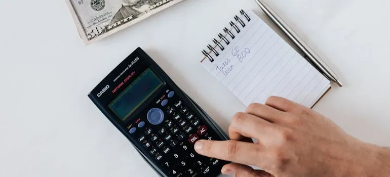 A person budgeting for the move and making a moving checklist for Rockville