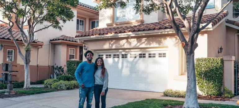 A couple in front of the house