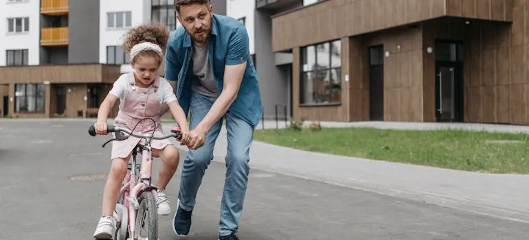A man and a kid on the bicycle
