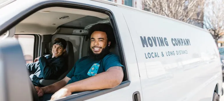 Movers in the moving van who help people relocate from Maryland to Virginia in a hurry