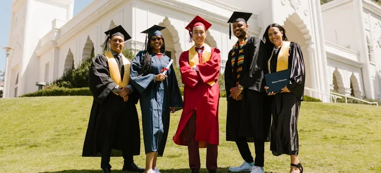 Students wearing graduation gowns 